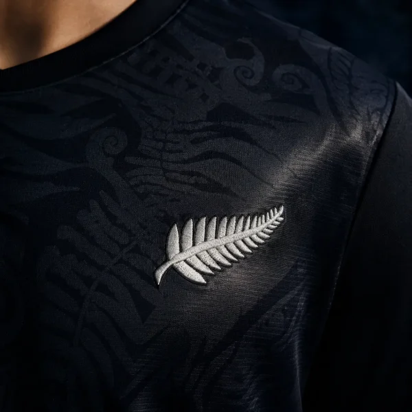 New Zealand silver fern on black jersey fabric background