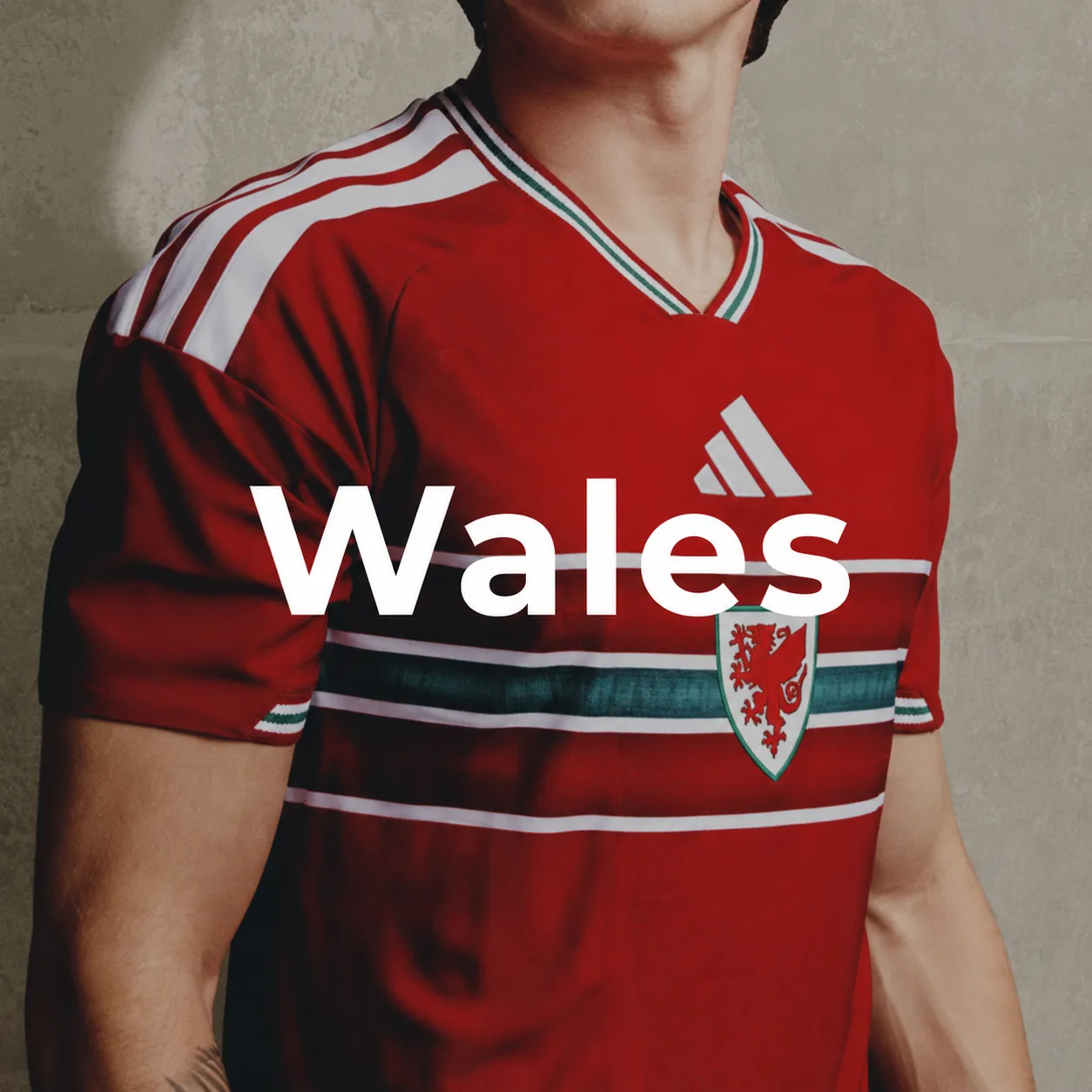 Wales football jersey on red fabric background