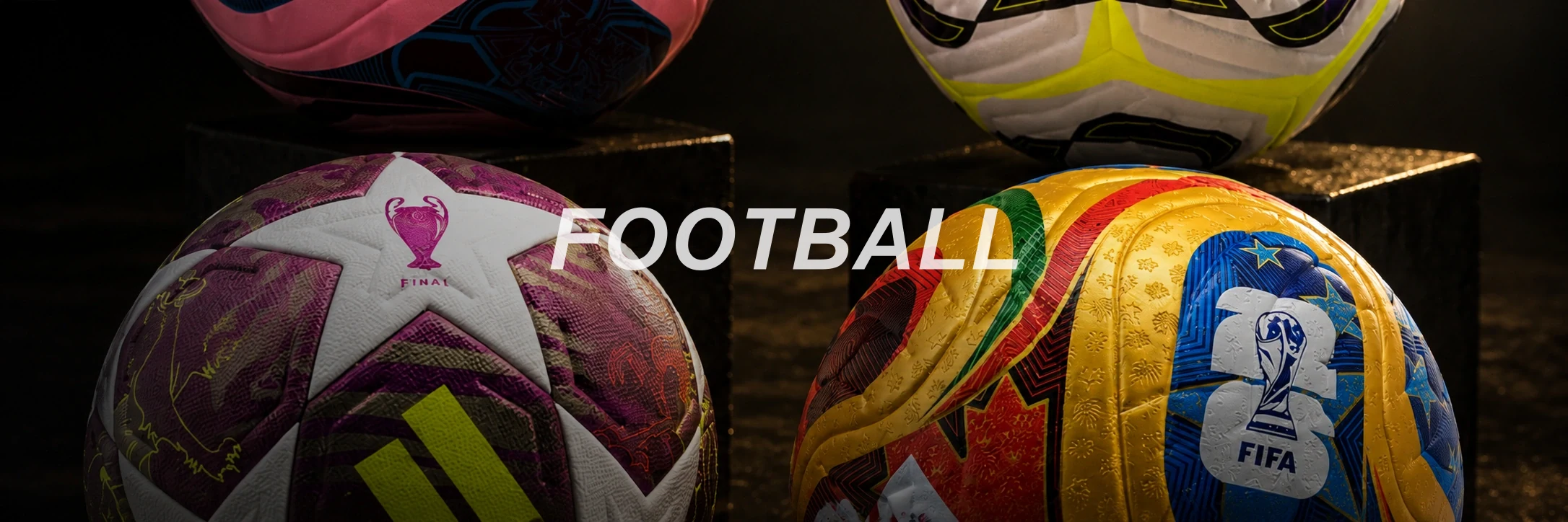 Colorful soccer balls on dark display background