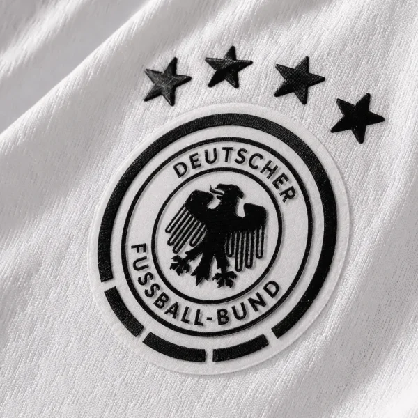 Germany football crest on white jersey fabric background